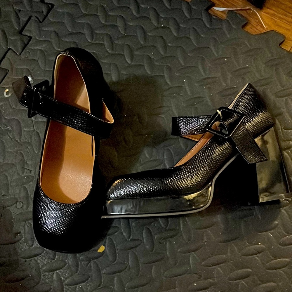 Black Mary Jane platforms. New. Size 7.5